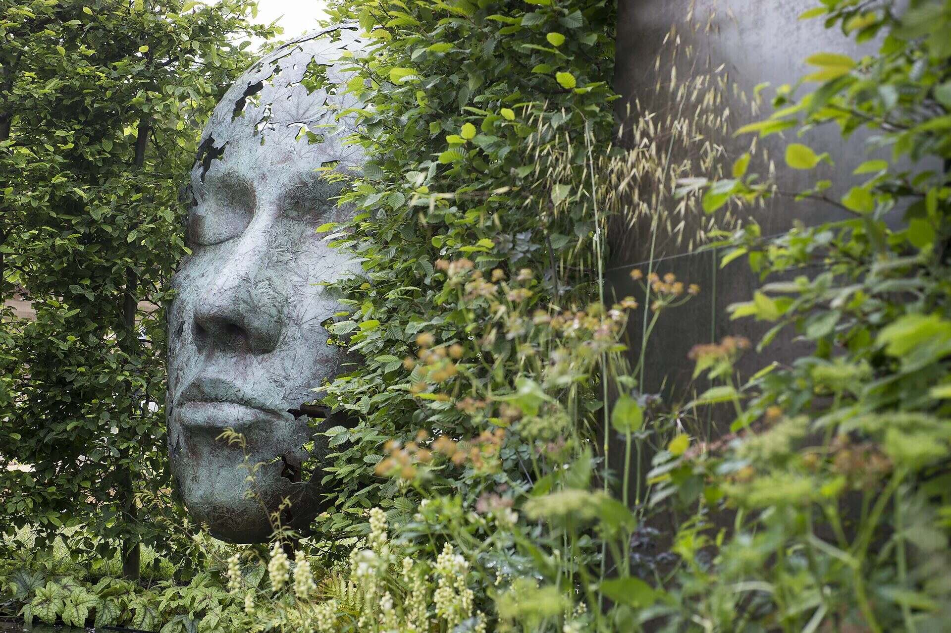 Show garden at RHS Chatsworth showing sculpture